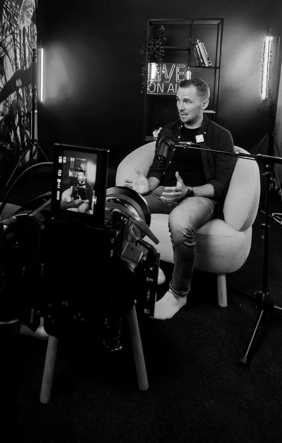Joona Salokangas being filmed in a studio interview